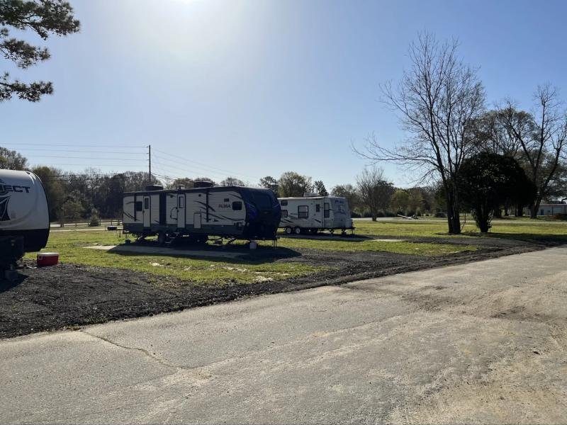 Travel trailers parked on back-in pads